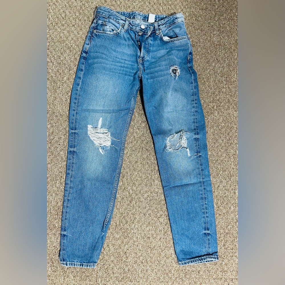Distressed denim. Great condition. Button down fly.
